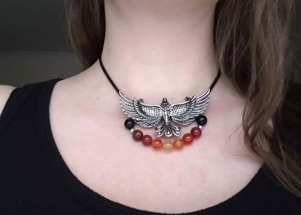 Little Joys: silver phoenix necklace with orange and yellow gemstone beads strung below