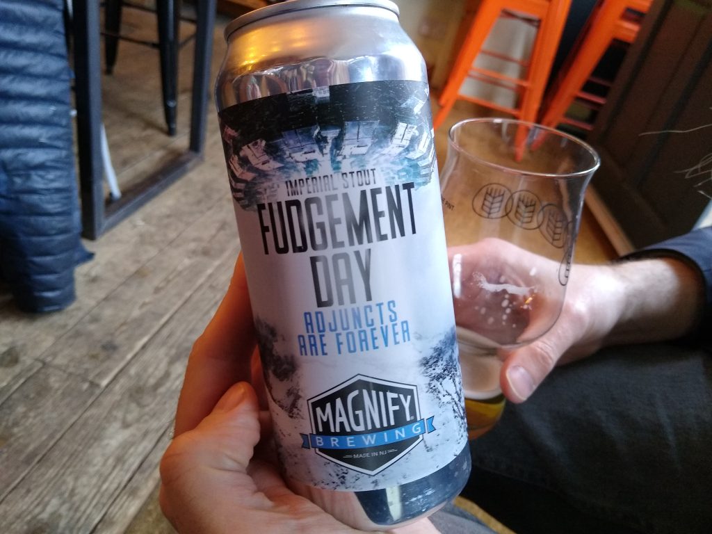 Little Joys: 'Fudgement Day' imperial stout can in a tap room