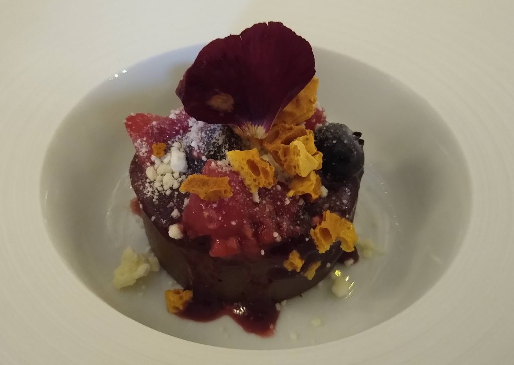 Little Joys: fancy chocolate dessert with honeycomb, berries and edible flowers