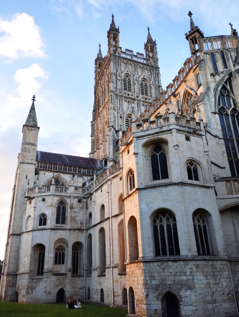 Photo: View up at Gloucester cathedral, with low sunlight from the left.