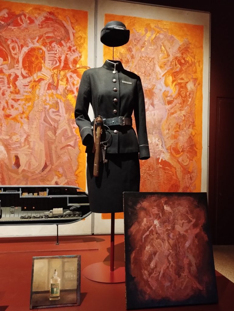 Little Joys: photo of an exhibit showing murals, art, costume and props from Wes Anderson's The French Dispatch.